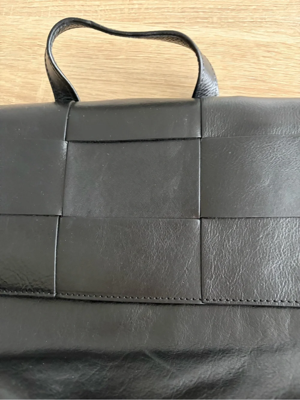 Structured Black Leather Top-Handle Satchel with Woven Flap Detail